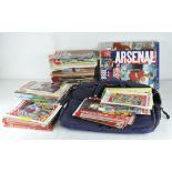 A collection of assorted football programmes and cassettes, most relating to Arsenal,