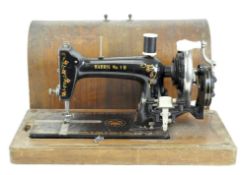 An early 20th century Harris No 1H sewing machine, in original carry case