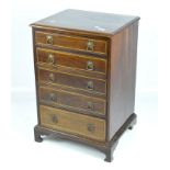 A Victorian mahogany chest of drawers within inlaid decoration, five drawers with metal handles,
