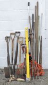 A collection of gardening tools, including spades, pitchforks and shears,