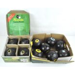 Seven Thomas Taylor lawn bowls, together with a boxed set of Herselite lawn bowls