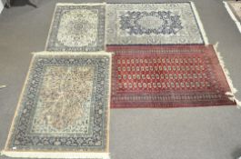 Four Persian style rugs,