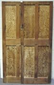 A pair of solid four panel pine doors,