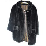 A ladies vintage faux fur coat,
