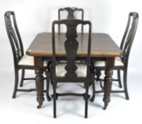 A Victorian mahogany extending dining table and six chairs