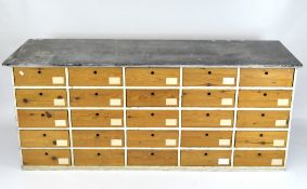 A slate topped multi-drawer unit, consisting of 25 drawers,