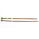 Two wooden swagger sticks, each with metal ball finial's cast with coronets,