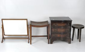 A small Georgian style mahogany chest, an oak dressing table mirror and two stools,
