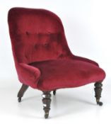 A Victorian mahogany red valour fabric upholstered nursing chair, button back,