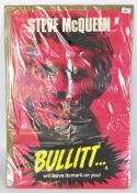 A large movie poster for the film Bullitt, starring Steve McQueen,