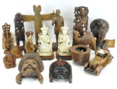 A selection of wooden items, including African and Asian carvings,
