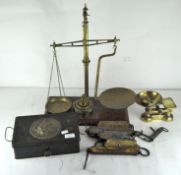 A group of scales and weights, including balance scales, pocket balance and more,