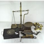 A group of scales and weights, including balance scales, pocket balance and more,