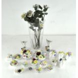 A collection of decorative floral posy vases,