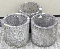 A set of three Sandford Stone pots, modelled as tree trunks,