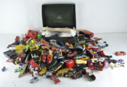 A large selection of die-cast vehicles and other vintage toys,