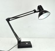 A vintage angle poise lamp, in black enamel on plastic base,
