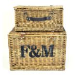 Two wicker picnic baskets, the larger being from Fortnum and Masons,