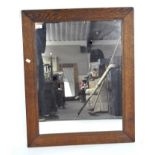 A 20th century oak wall mirror of rectangular form,