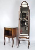 A mahogany cheval mirror, of rectangular form, with shaped top, raised on cabriole legs,