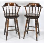 A pair of 20th century bar or kitchen swivel stools,