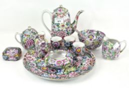 A Japanese style porcelain selection of wares with millefleur decoration, including tea pot,