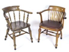 A pair of 20th century tub chairs with turned supports, one with red padded seat,