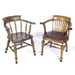 A pair of 20th century tub chairs with turned supports, one with red padded seat,