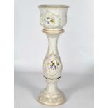 A Capodimonte style jardiniere and baluster stand with moulded lattice work style decoration