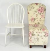 An upholstered chair with lift up seat revealing storage,