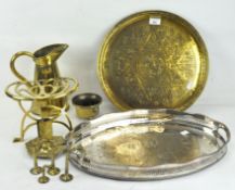 A selection of brassware, including a trivet stand, pouring jug and tray and a silver plate tray