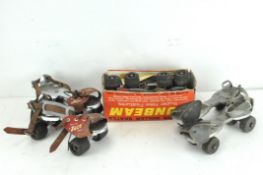 Three pairs of vintage roller skates, including a pair by Jaco and another by Sunbeam,