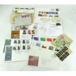 A selection of stamped envelopes and loose stamps,