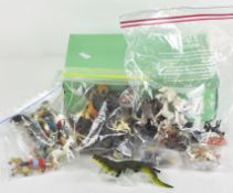 A collection of assorted vintage toys, most being plastic, including various tropical animals,