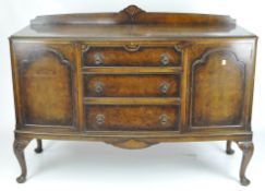 A mahogany bow front sideboard, three central drawers with a cupboard to either side,