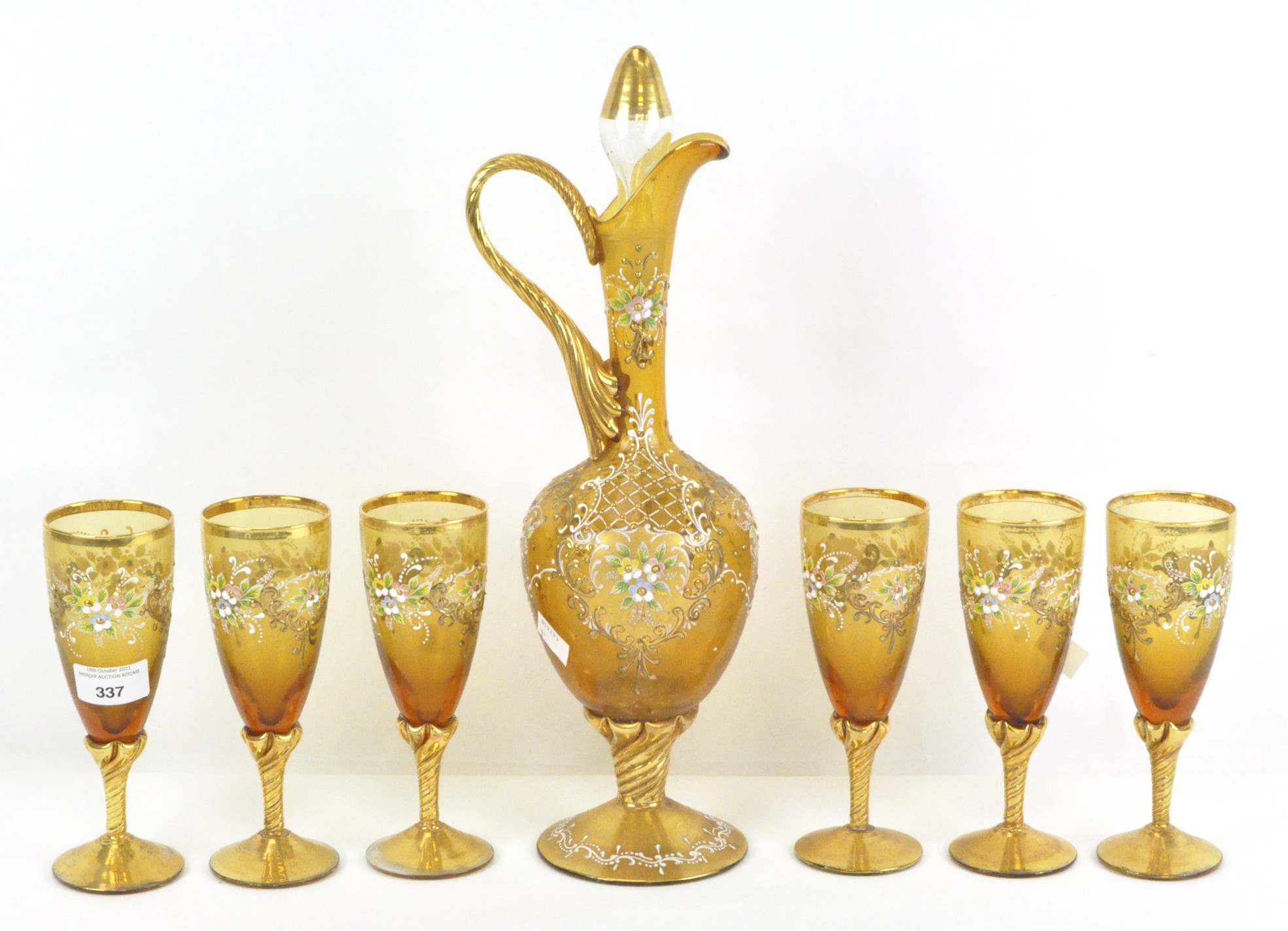 A Facon de Venise style jewelled and enamelled glass ewer and stopper and six wine glasses,