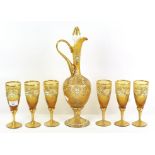 A Facon de Venise style jewelled and enamelled glass ewer and stopper and six wine glasses,