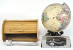 A vintage desk globe together with a wooden bread bin, an Ever Brite torch and a boxed model car