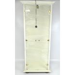 A 20th century collector's display cabinet of white painted wood with glass hinged doors