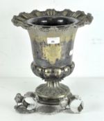 A silver plated wine cooler/bucket, raised upon pedestal base, with two silver plated napkin rings