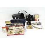 A collection of vintage costume jewellery and other items, including compacts,