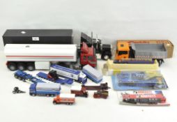 A collection of assorted model lorries and trucks of varying makes and designs