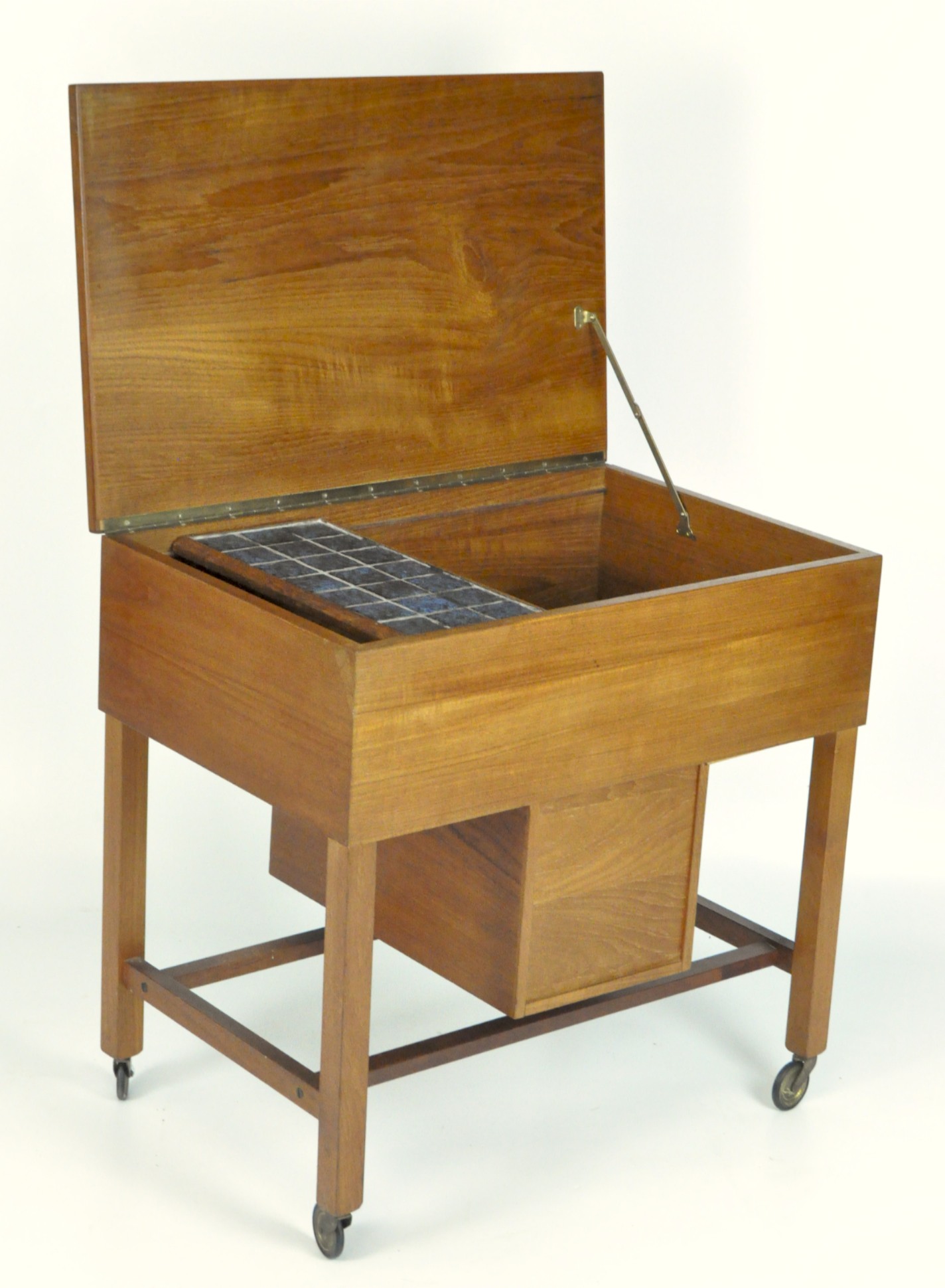 A 1960's teak work table with hinged cover, on wheels, - Image 2 of 2