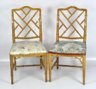 A pair of caned simulated bamboo chairs, the seats upholstered,