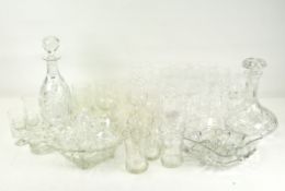 A large collection of cut and engraved glassware, including: sets of wine glasses in sizes, beakers,