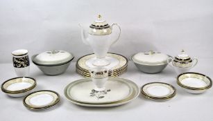 A Wedgwood 'Cornucopia' part tea service with plates, bowls, vase, coffee pot, and more,