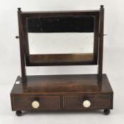 A Victorian mahogany dressing table mirror, the rectangular mirror raised over two drawers,