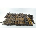A large collection of wooden planes,