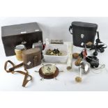 An assortment of collectables, including two pairs of binoculars and a vintage pencil sharpener