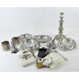 A collection of silver plated wares, including single candlestick,